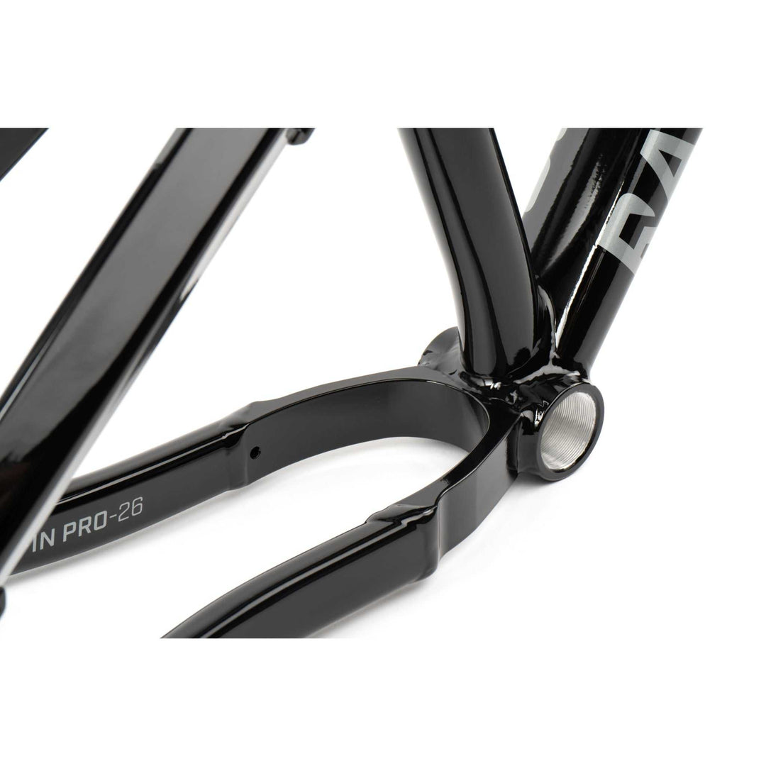 Close-up of black RADIO GRIFFIN PRO hydroformed alloy BMX bike frame with crankset area and rear dropouts.