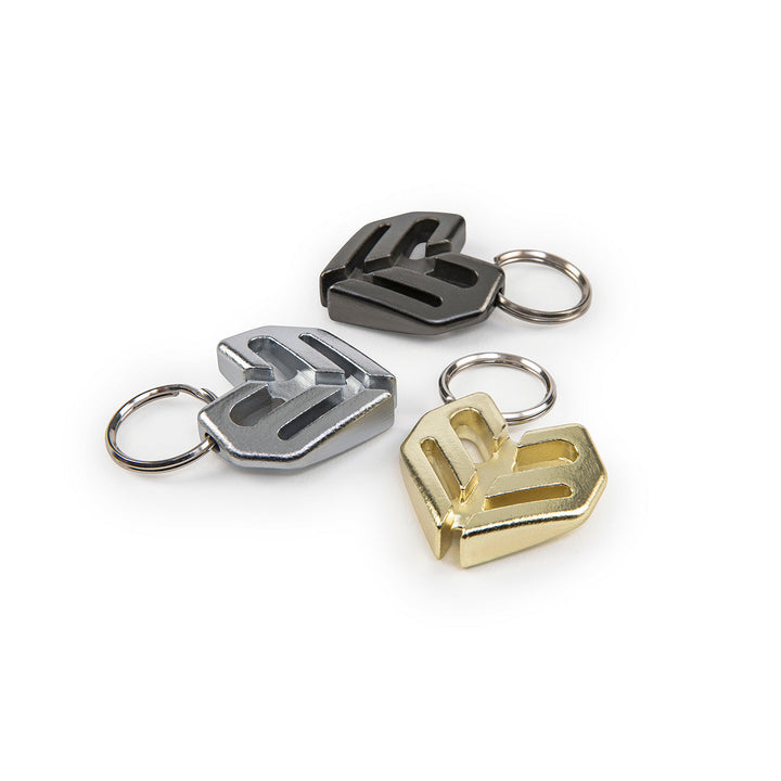 ÉCLAT SPOKE KEY CHAIN in black, silver, and gold, made from durable heat-treated chromoly.